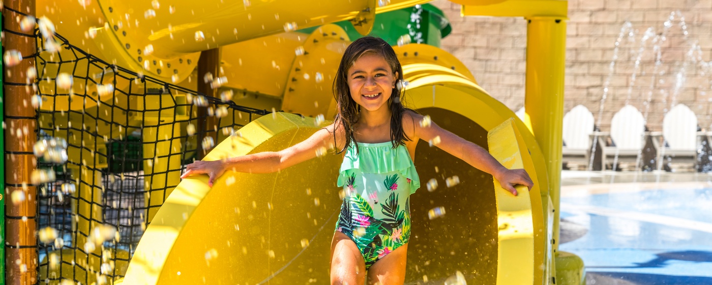 Image of girl in front of waterslide.