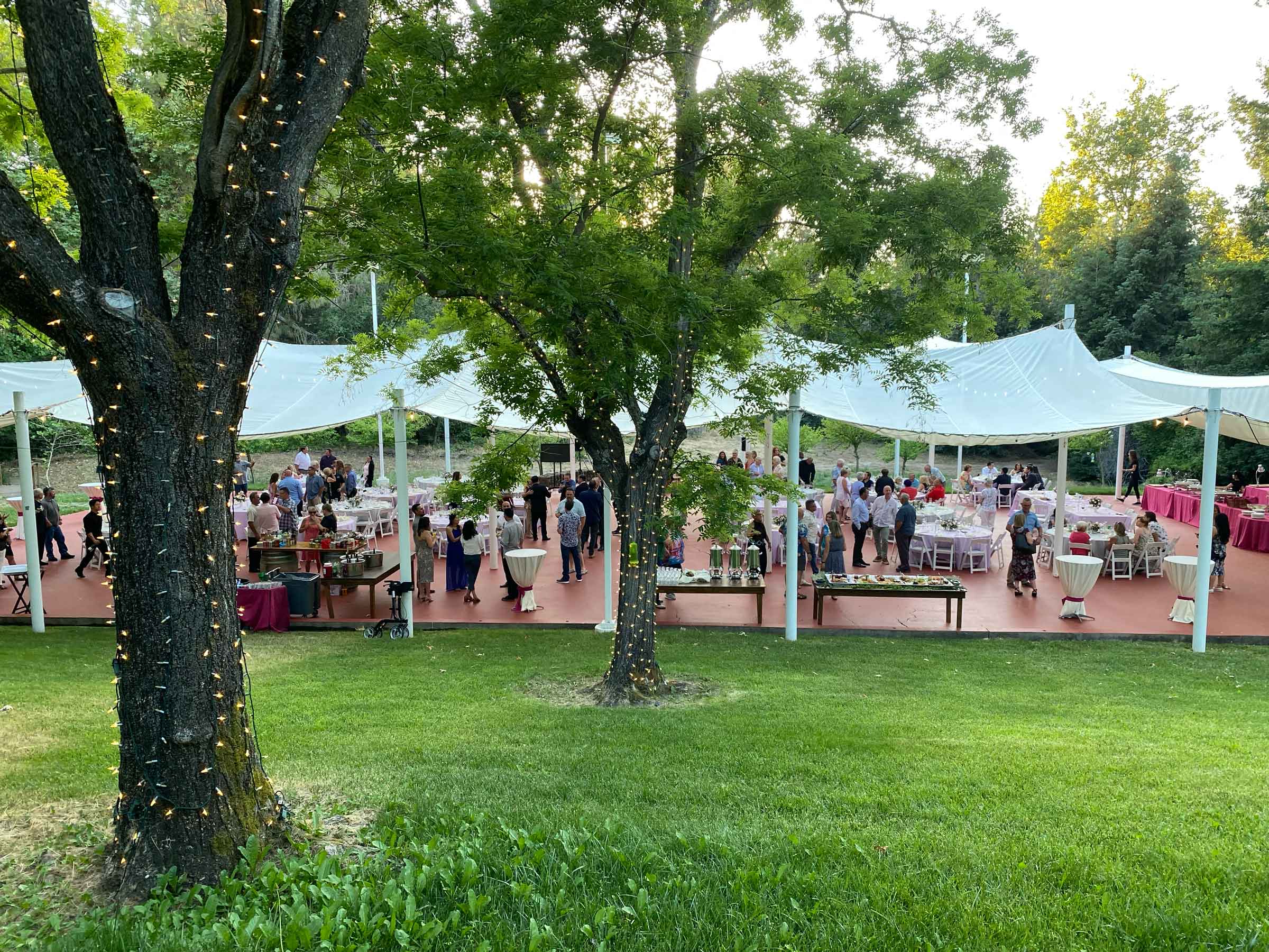People eating and dancing at a wedding at Creekside Terrance