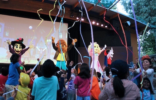 Vinnie the Vampire, Wolfgang Werewolf, Princess and Wendella the Witch dancing after saving Halloween.