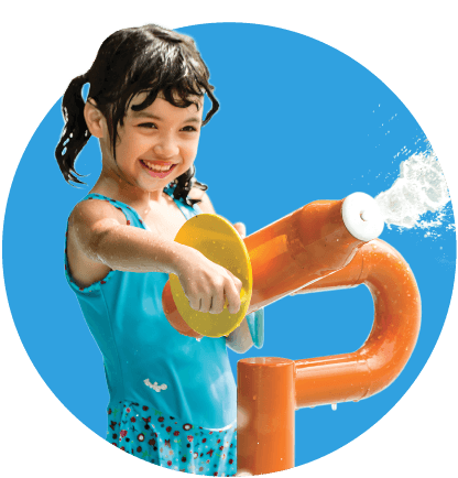 Little girl with pigtails in a light blue swimsuit using an orange squirt gun.