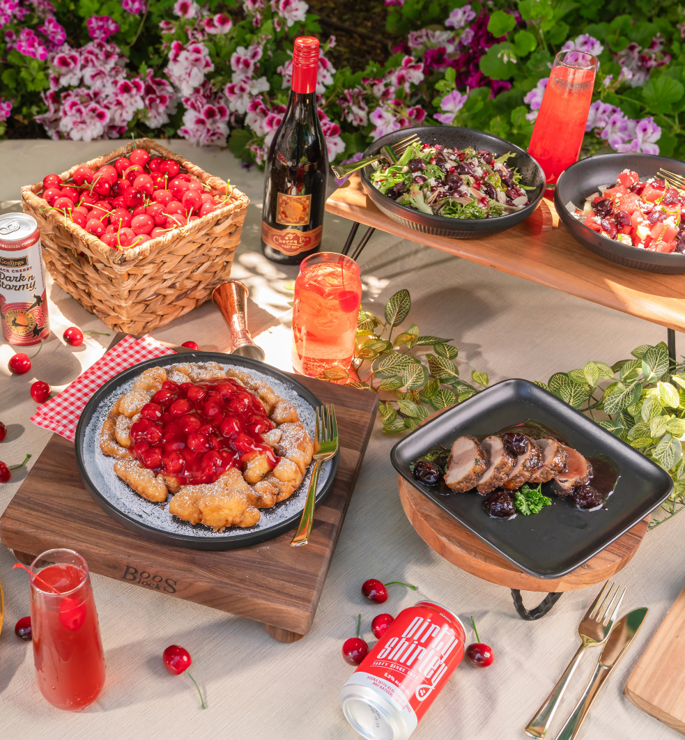 Funnel cake with cherries on top, grilled chicken with cherries, a basket of cherries, cherry salad and cherry ceviche