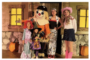 Guests taking photos with members of the Great Big BOO